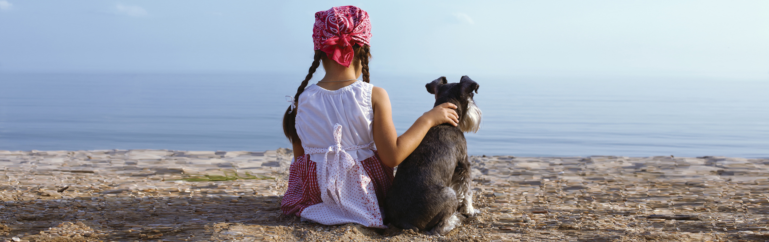 Girl on beach with dog